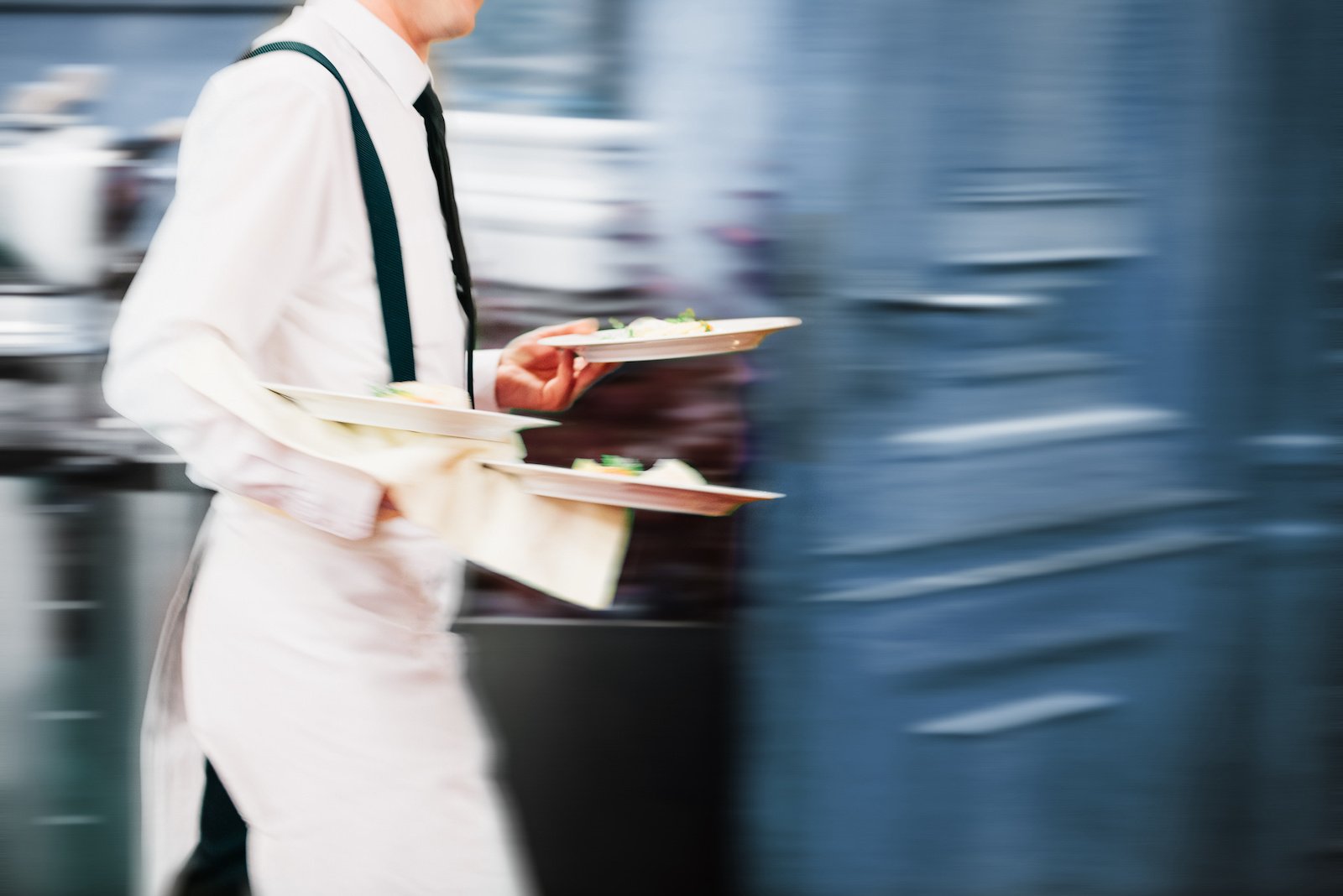 Restaurant employee running food